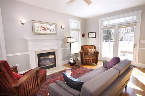110 Robbins Road Arlington, MA 02476 - Photo 6 of 18 a living room with furniture a fireplace and a window