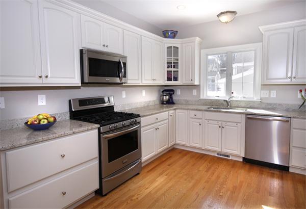 110 Robbins Road Arlington, MA 02476 - Photo 10 of 18 a kitchen with stainless steel appliances white cabinets and a sink