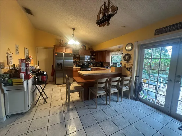 a bed room with a bed a couch and a window