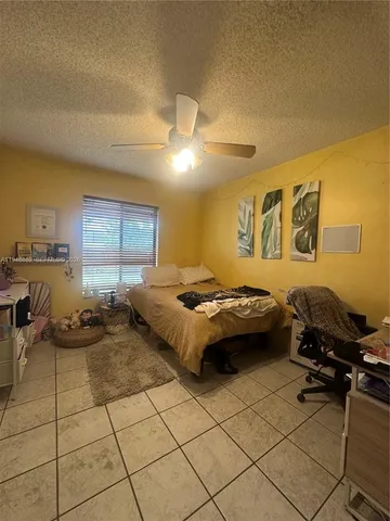 a bedroom with a bed and closet