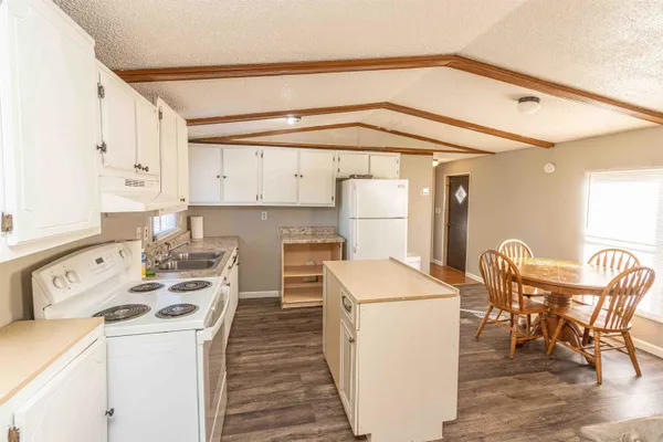 a kitchen that has a cabinets and a stove