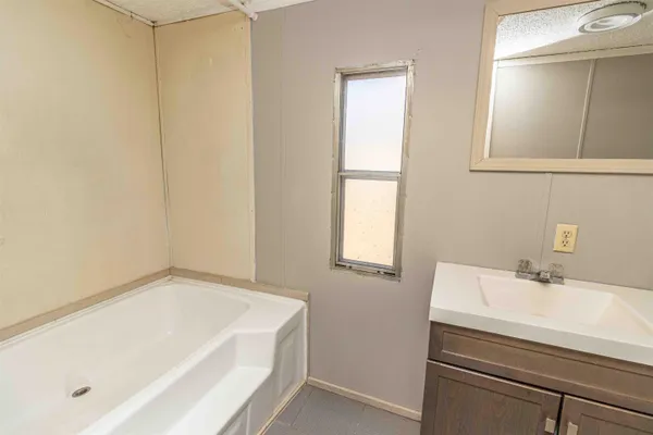 a bathroom with a bathtub and a sink