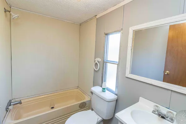 a bathroom with a tub and shower