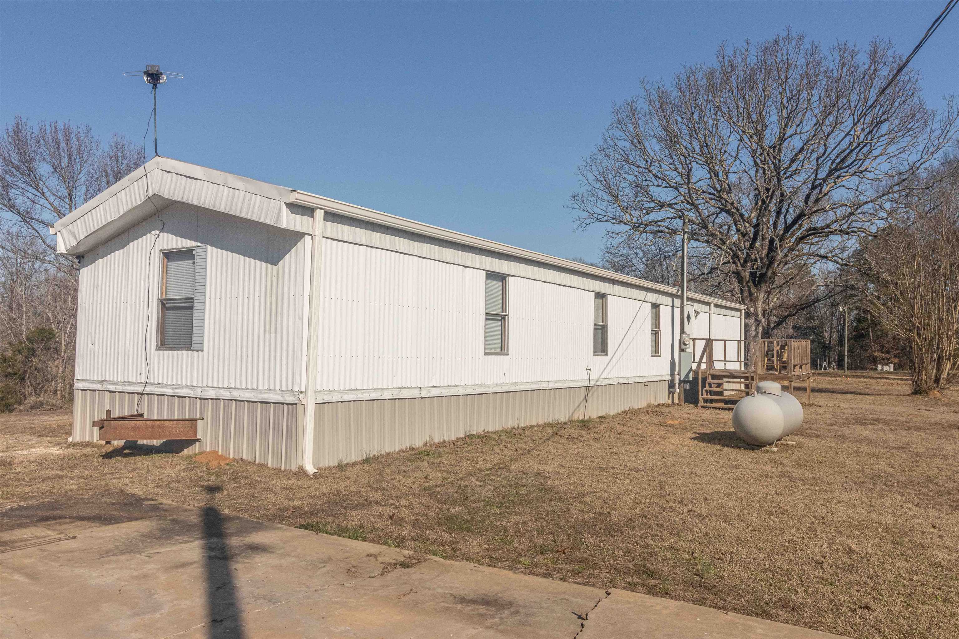 2419 Murray School Road Bethel Springs, TN 38315 - Photo 20 of 23 a front view of a house with a yard
