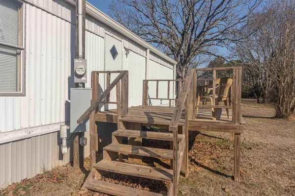 a front view of a house with stairs