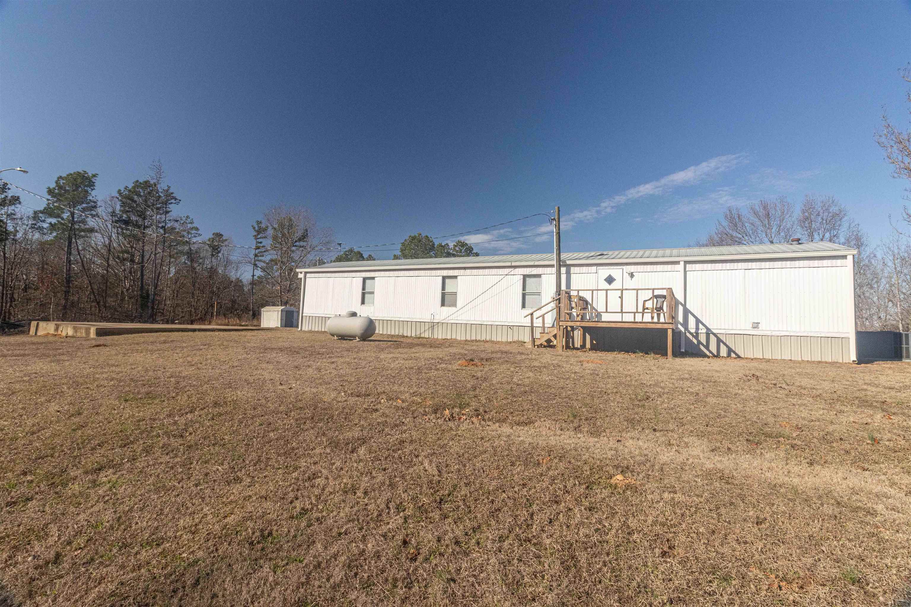 2419 Murray School Road Bethel Springs, TN 38315 - Photo 21 of 23 a view of a house with a yard