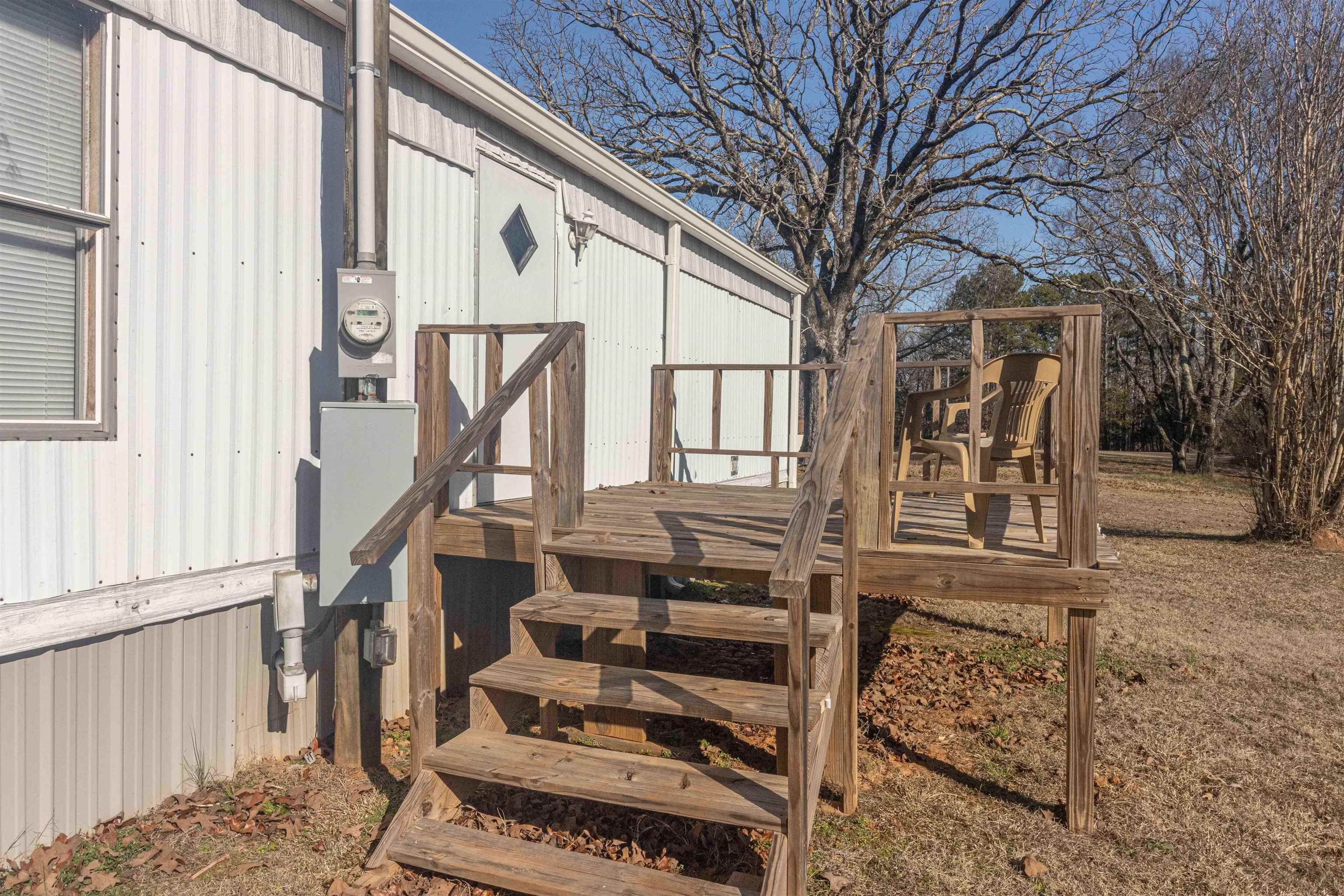 2419 Murray School Road Bethel Springs, TN 38315 - Photo 22 of 23 a front view of a house with stairs
