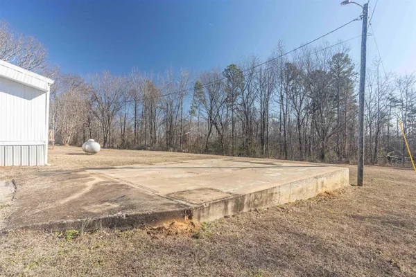 a view of empty space yard and trees