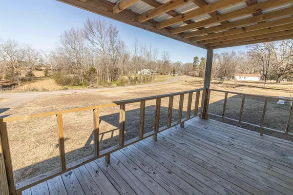 a view of a balcony with wooden floor