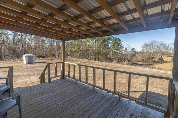 a view of a balcony with wooden floor