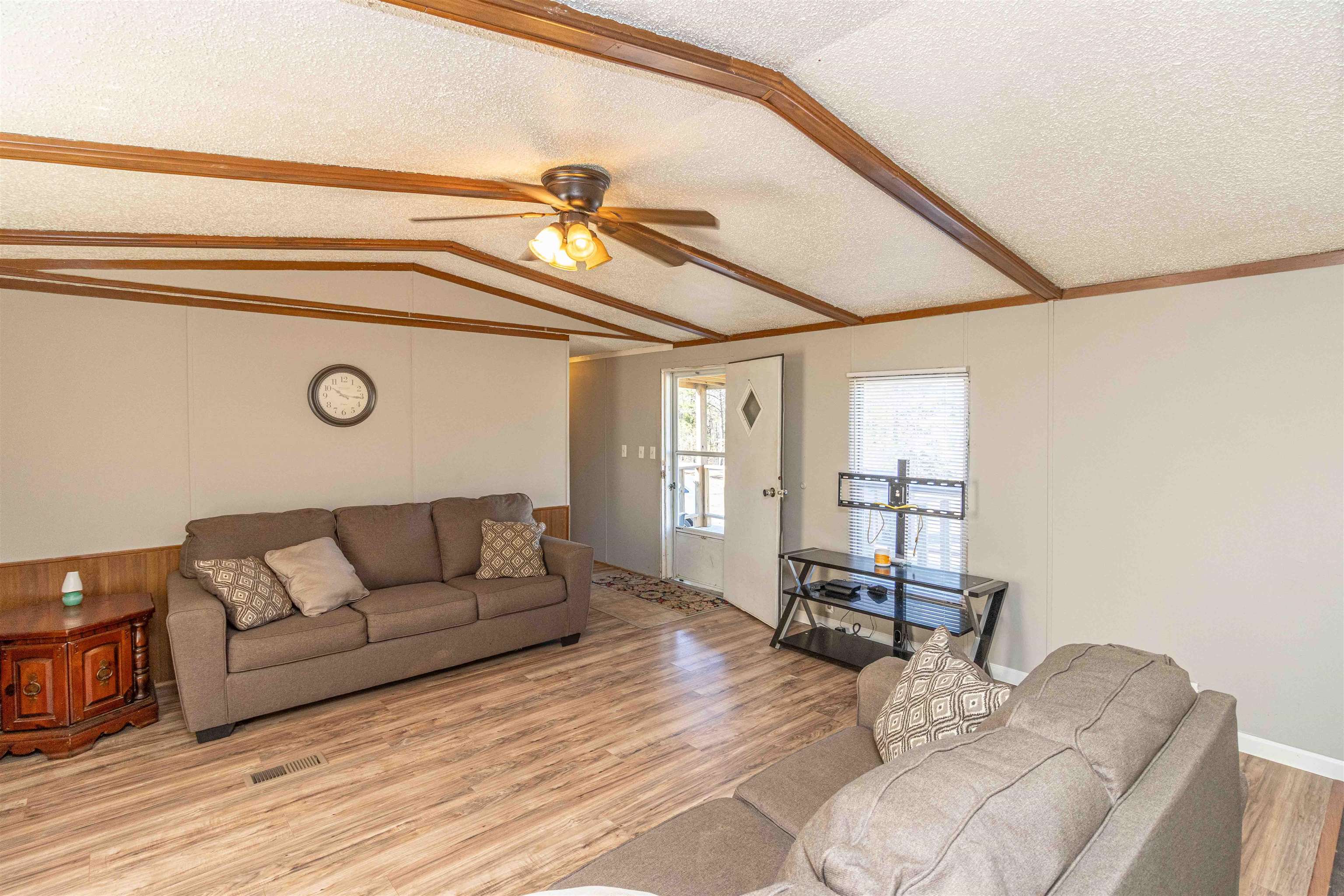 2419 Murray School Road Bethel Springs, TN 38315 - Photo 8 of 23 a living room with furniture and a flat screen tv