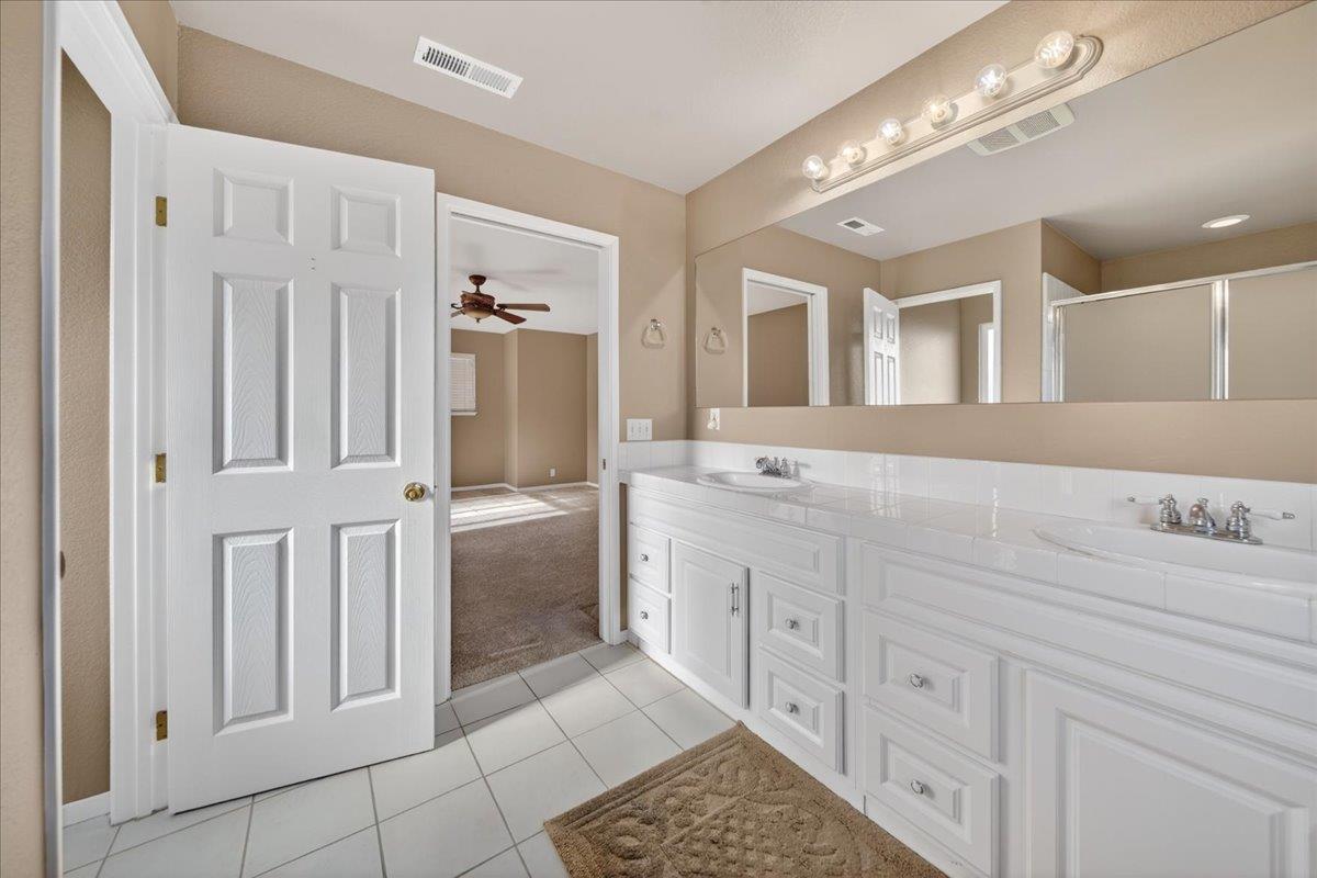 1282 Hamilton Avenue Seaside, CA 93955 - Photo 20 of 45 a spacious bathroom with a double vanity sink a mirror a bathtub and a shower
