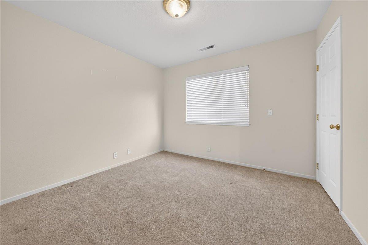 1282 Hamilton Avenue Seaside, CA 93955 - Photo 28 of 45 an empty room with windows and mirror