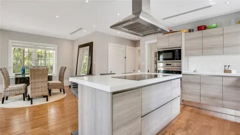 a kitchen with counter top space and sink