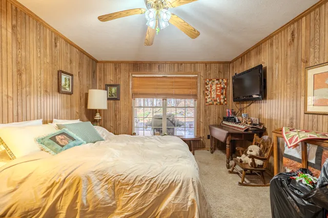 a living room with lots of furniture and a book shelf
