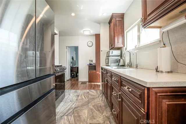 a stove top oven sitting inside of a kitchen