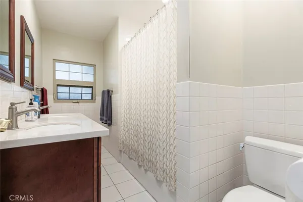 a bathroom with a sink a vanity and a mirror