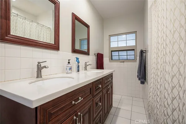a living room with wooden floor and furniture