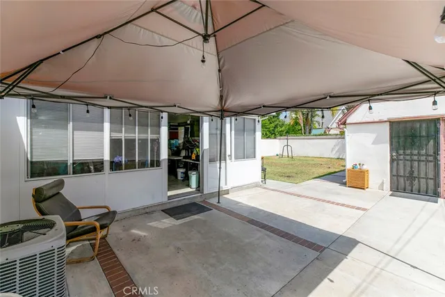 a room with furniture a flat screen tv and a window