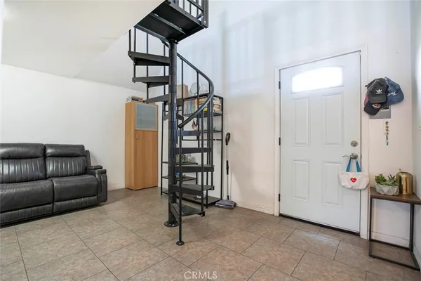 a kitchen with stainless steel appliances kitchen island granite countertop a refrigerator and a stove top oven