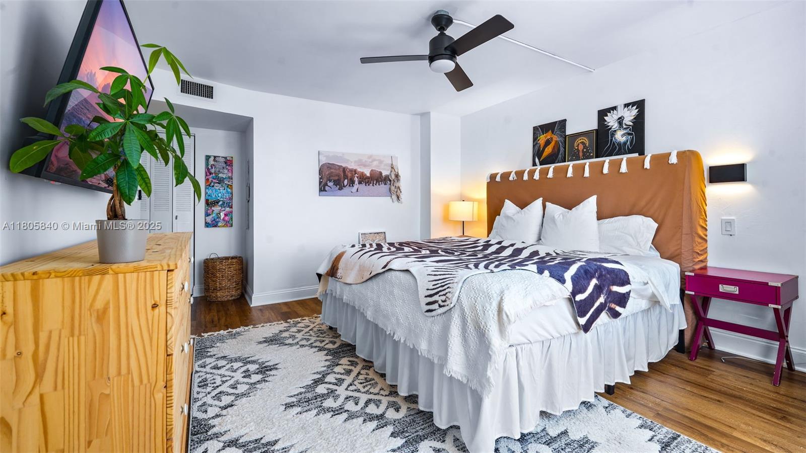 2750 Northeast 183rd Street, Unit 1610 Aventura, FL 33160 - Photo 11 of 16 a bedroom with bed and a painting on the wall