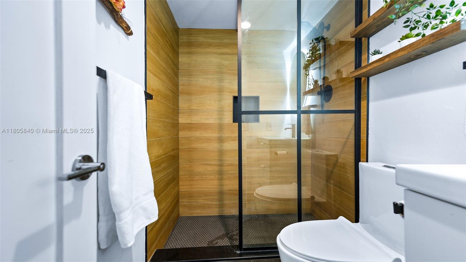 2750 Northeast 183rd Street, Unit 1610 Aventura, FL 33160 - Photo 14 of 16 a bathroom with a toilet and a shower