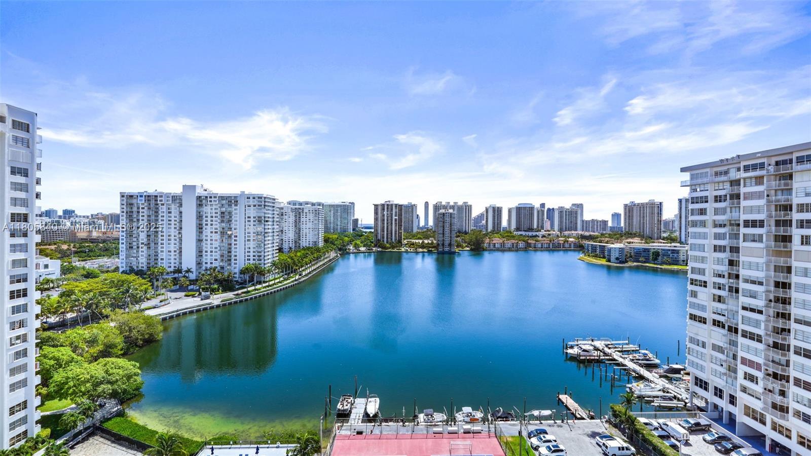 2750 Northeast 183rd Street, Unit 1610 Aventura, FL 33160 - Photo 3 of 16 a view of a lake with a city