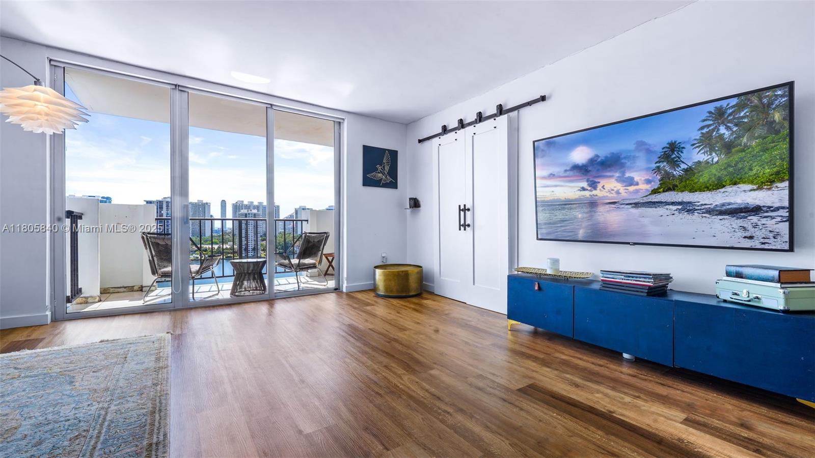 2750 Northeast 183rd Street, Unit 1610 Aventura, FL 33160 - Photo 4 of 16 a view of a living room with furniture and floor to ceiling window