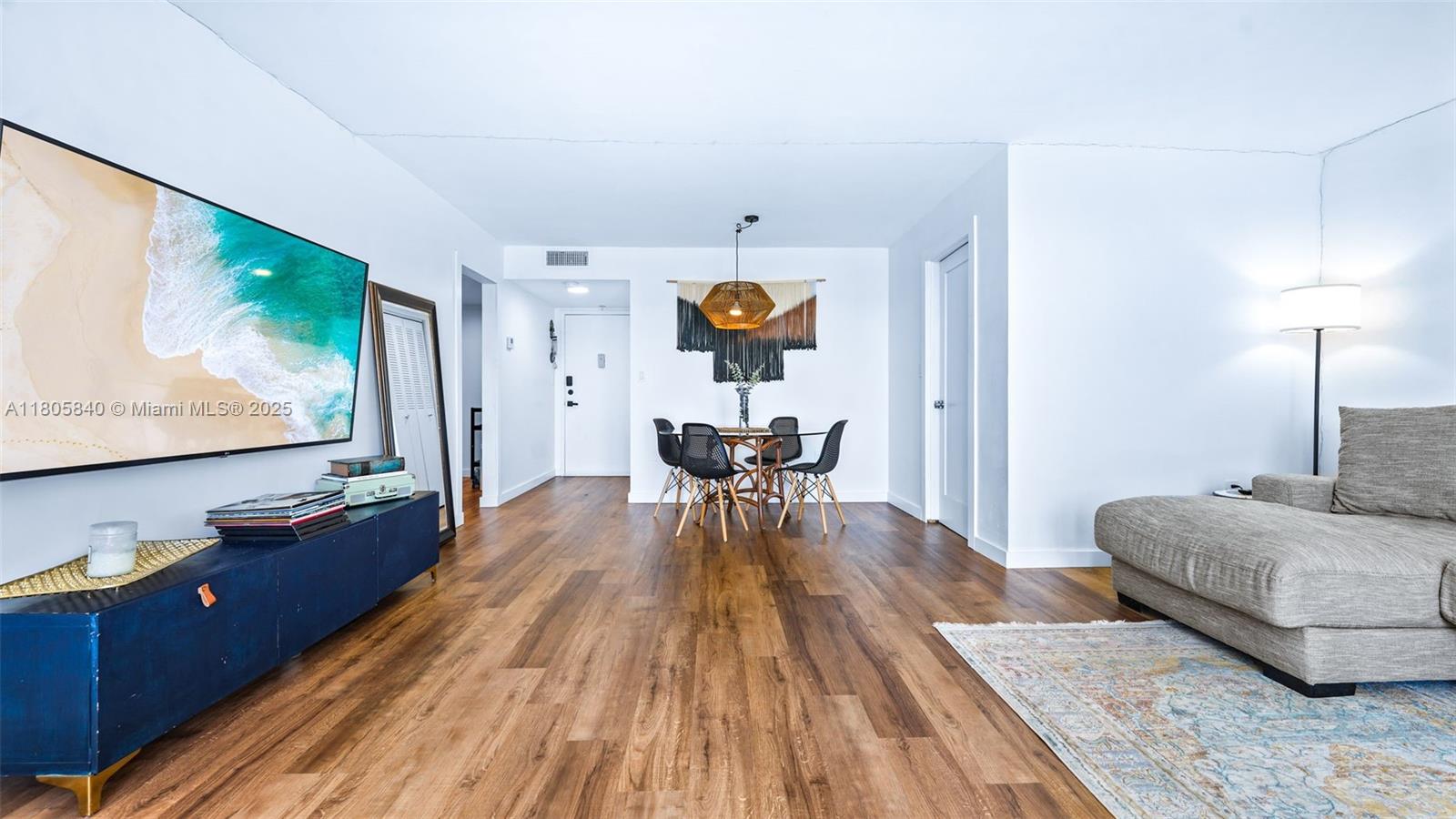 2750 Northeast 183rd Street, Unit 1610 Aventura, FL 33160 - Photo 6 of 16 a living room with furniture and wooden floor
