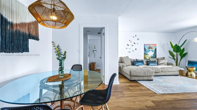 a living room with furniture and a mirror