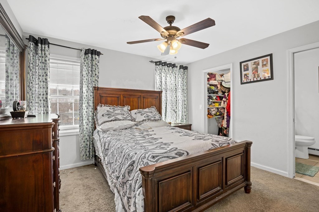 7 South Maxwell Court Worcester, MA 01607 - Photo 11 of 19 a bed sitting in a bedroom next to a window