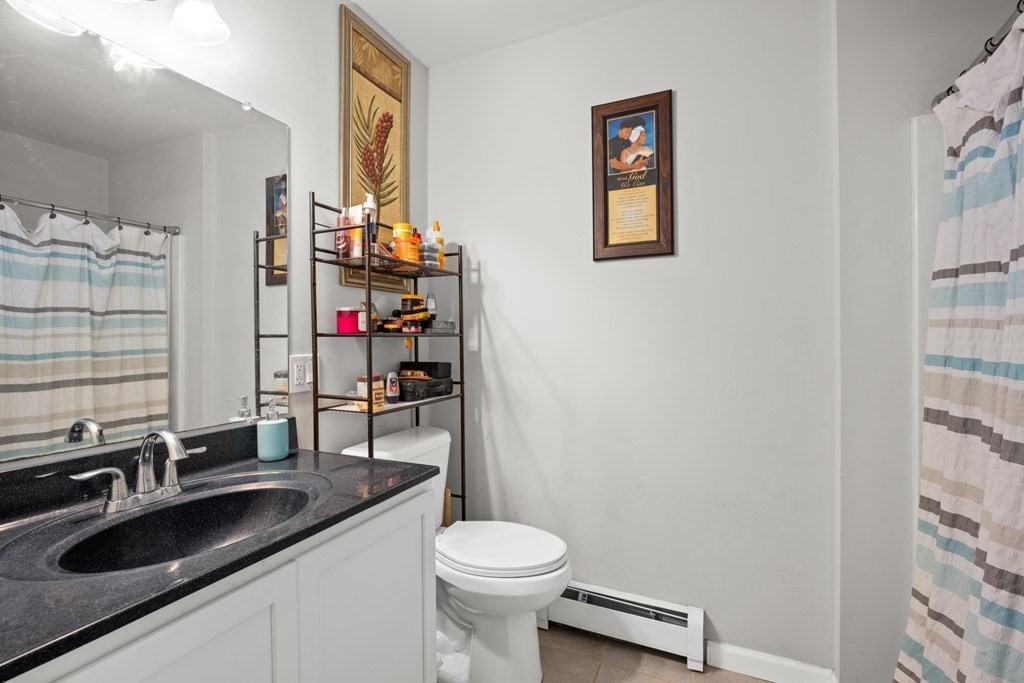 7 South Maxwell Court Worcester, MA 01607 - Photo 12 of 19 a bathroom with a sink a toilet and shower