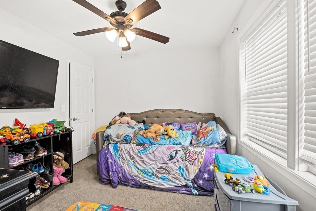 7 South Maxwell Court Worcester, MA 01607 - Photo 13 of 19 a bedroom with baby toys and a bed