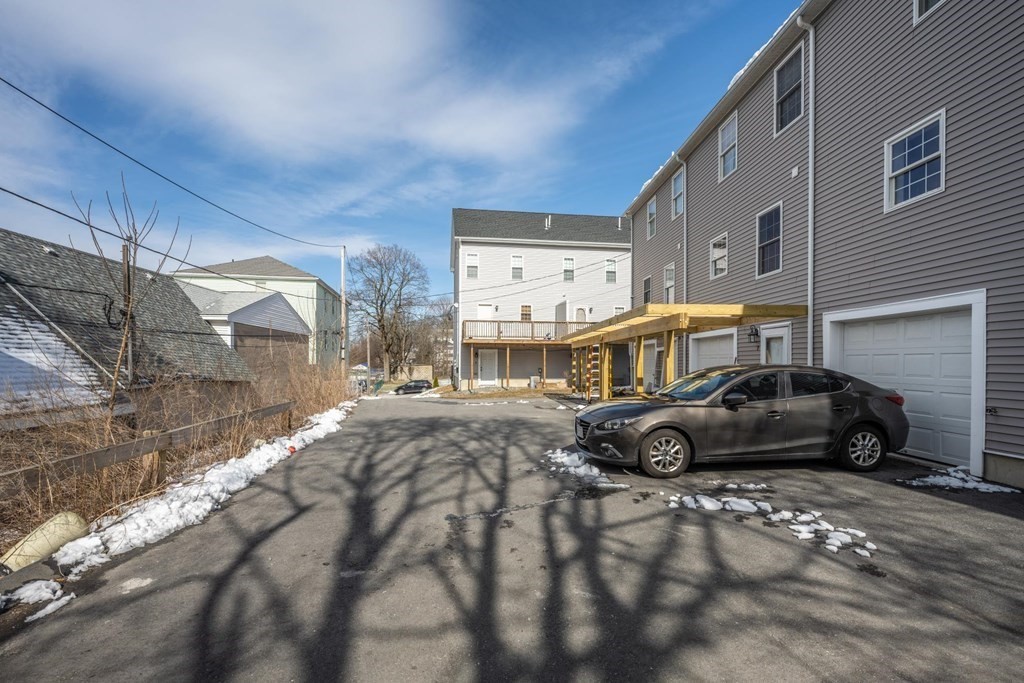 7 South Maxwell Court Worcester, MA 01607 - Photo 18 of 19 a car parked in front of a building