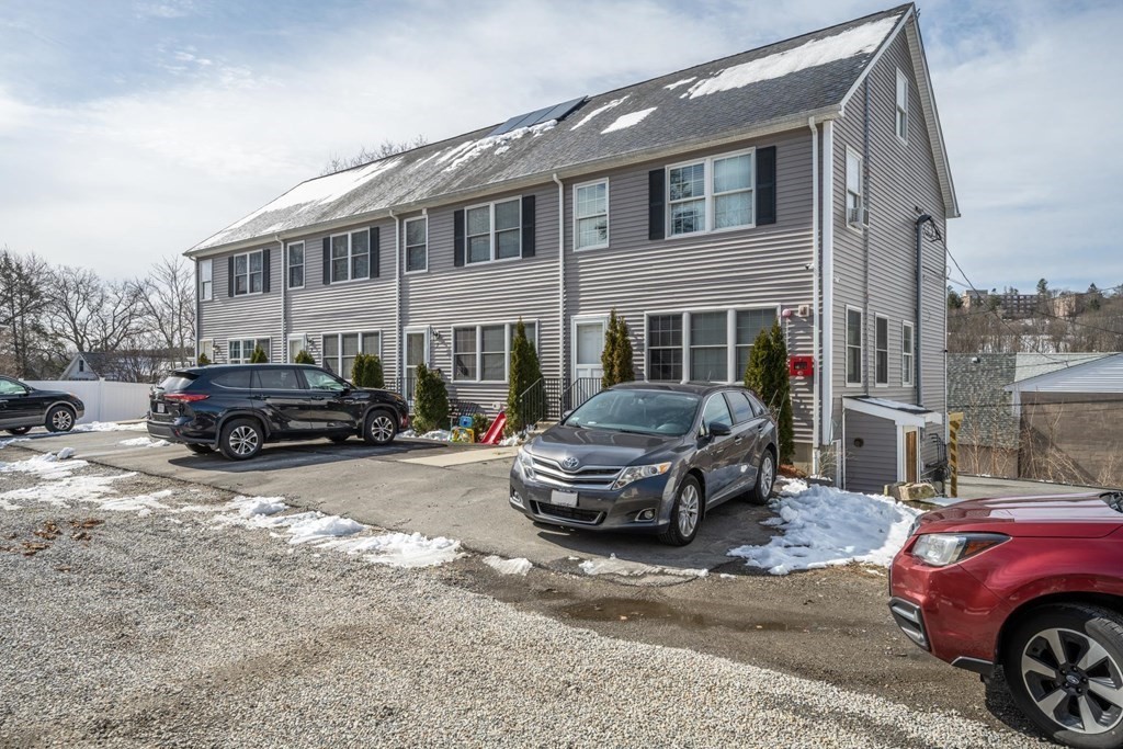 7 South Maxwell Court Worcester, MA 01607 - Photo 19 of 19 a front view of a house with cars parked