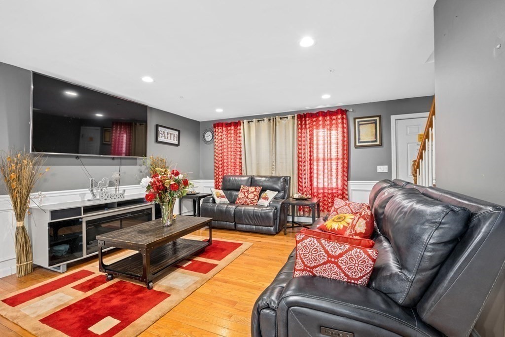 7 South Maxwell Court Worcester, MA 01607 - Photo 5 of 19 a living room with furniture and a flat screen tv