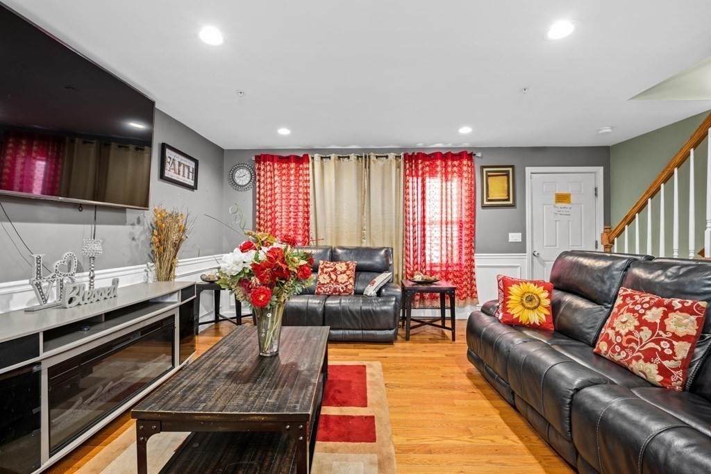 7 South Maxwell Court Worcester, MA 01607 - Photo 6 of 19 a living room with furniture and a flat screen tv