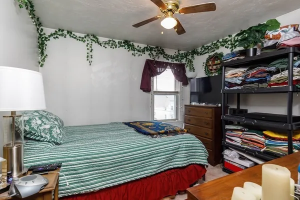a bathroom with a sink a mirror and next to a window