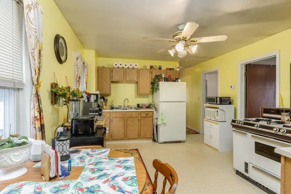 a living room with a rug floor and a table
