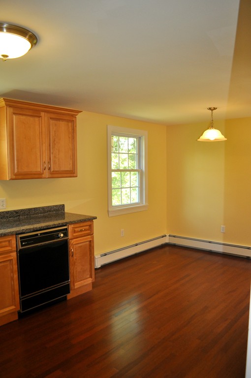 400 North Brookfield Road Barre, MA 01005 - Photo 6 of 25 an empty room with wooden floor and windows