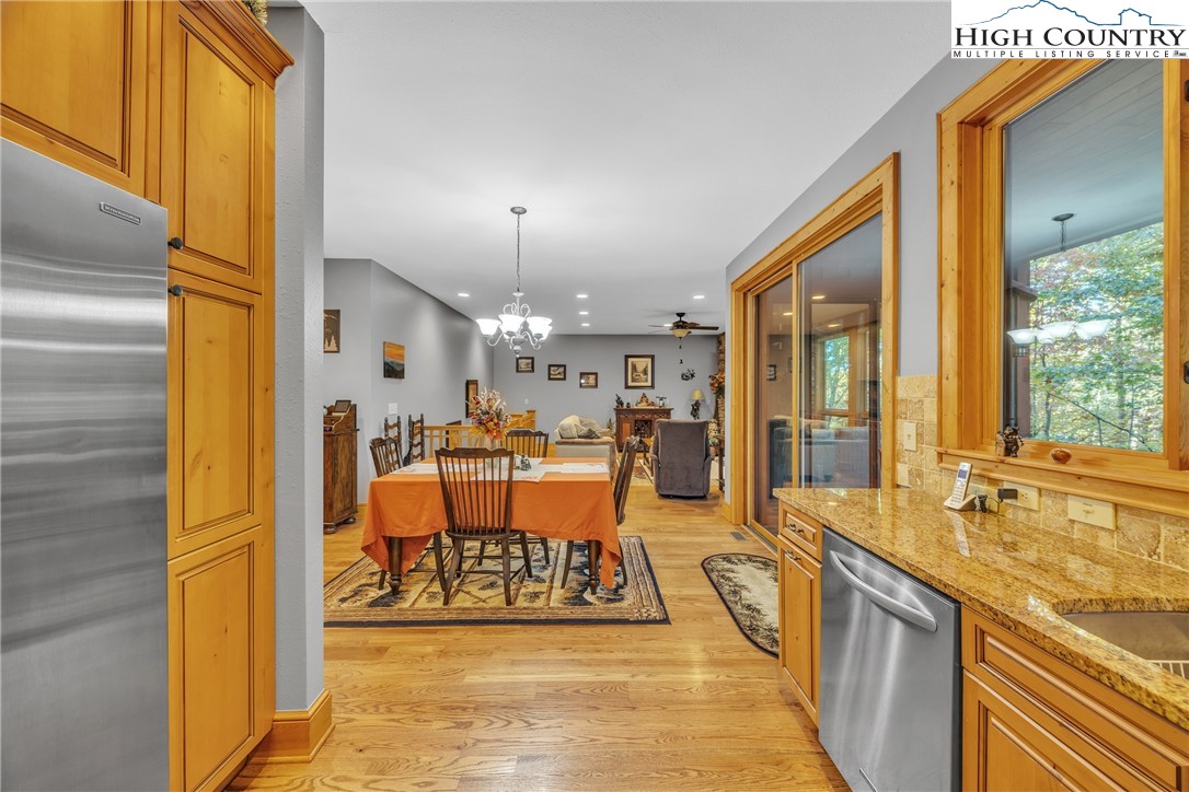 89 Springhouse Drive, Unit A4 Elk Park, NC 28622 - Photo 11 of 46 a view of a living room and kitchen