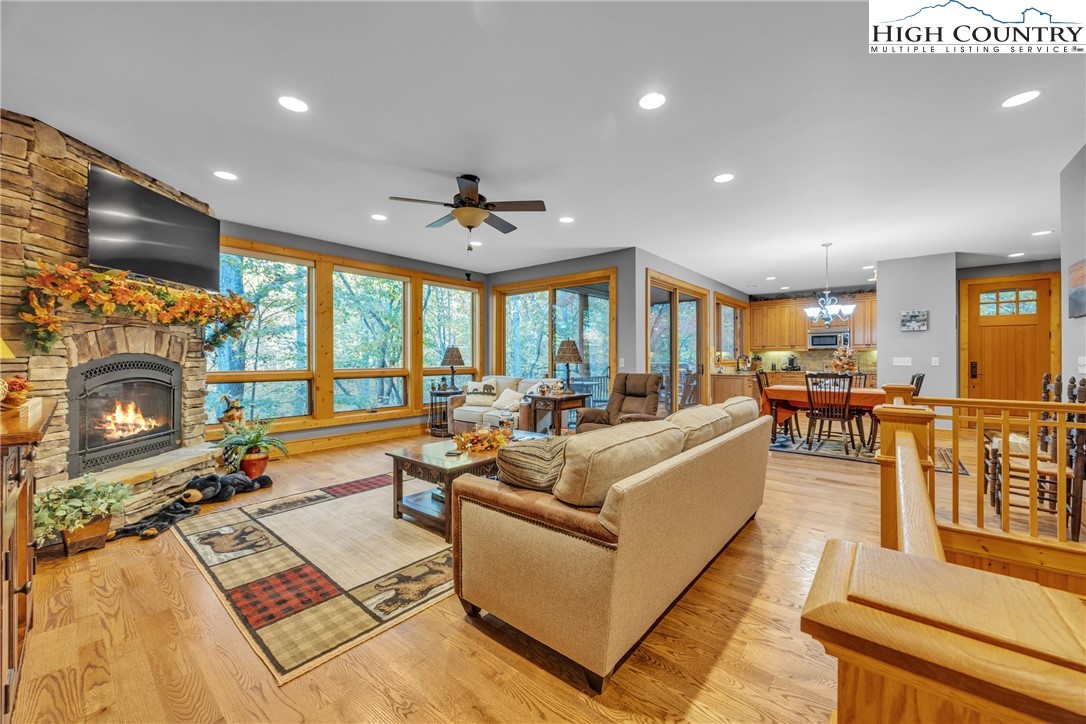 89 Springhouse Drive, Unit A4 Elk Park, NC 28622 - Photo 16 of 46 a living room with fireplace furniture and a large window