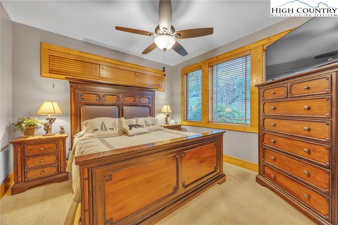 89 Springhouse Drive, Unit A4 Elk Park, NC 28622 - Photo 19 of 46 a bedroom with a bed and a dresser