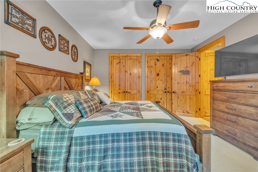 89 Springhouse Drive, Unit A4 Elk Park, NC 28622 - Photo 25 of 46 a bedroom with a bed and a window