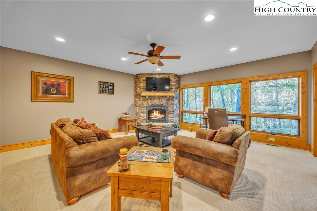 89 Springhouse Drive, Unit A4 Elk Park, NC 28622 - Photo 28 of 46 a living room with furniture and a large window