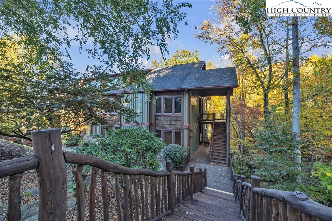 89 Springhouse Drive, Unit A4 Elk Park, NC 28622 - Photo 37 of 46 a house view with a garden space