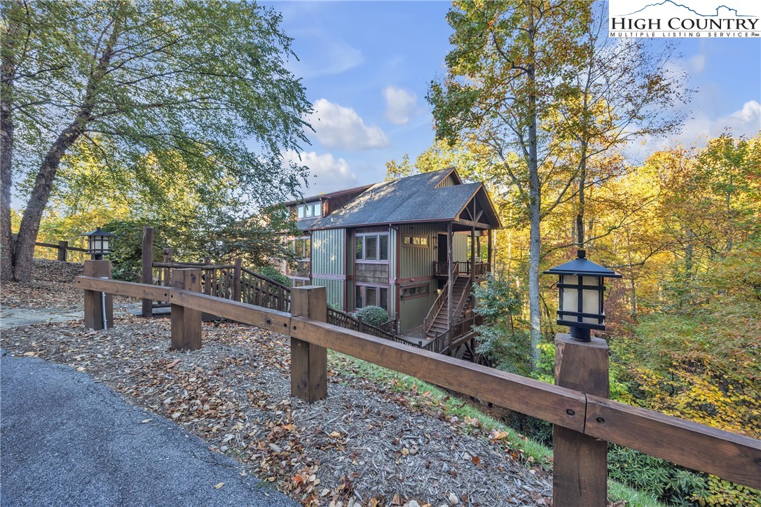 89 Springhouse Drive, Unit A4 Elk Park, NC 28622 - Photo 38 of 46 a front view of a house with garden