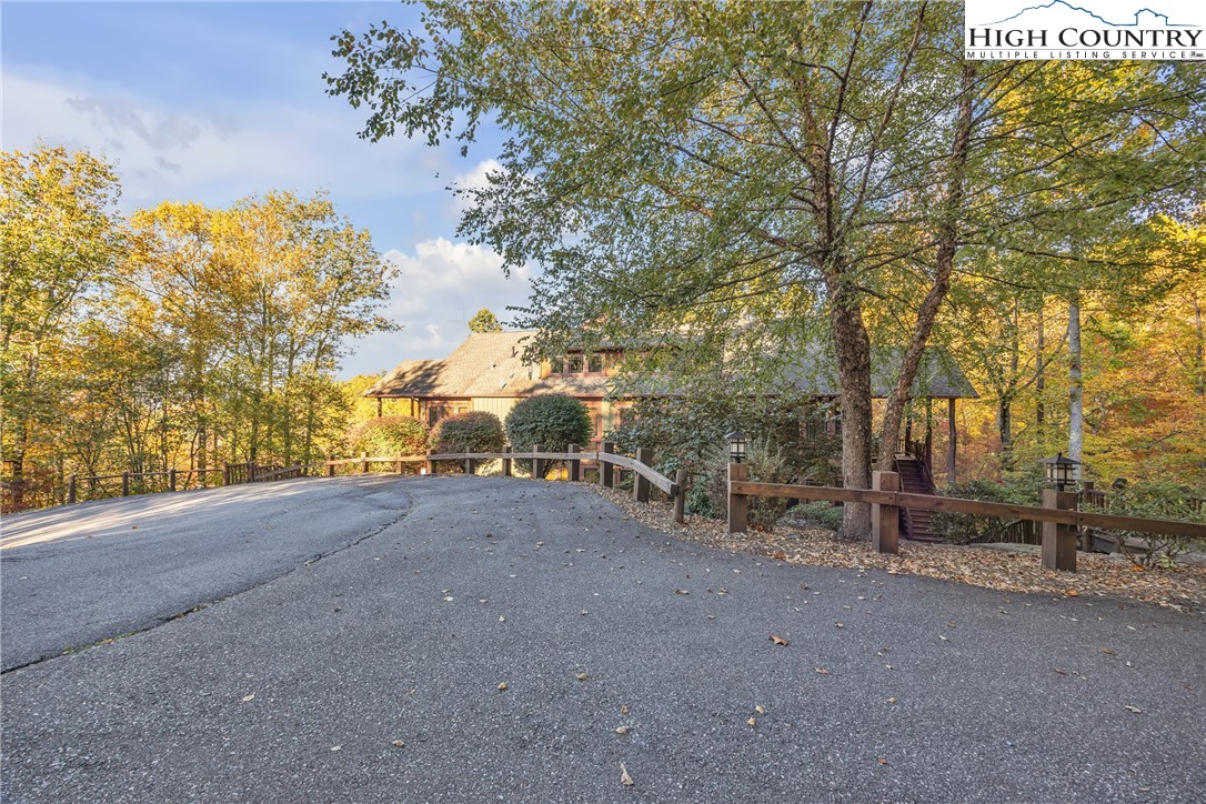 89 Springhouse Drive, Unit A4 Elk Park, NC 28622 - Photo 39 of 46 a view of a field with trees in front of it