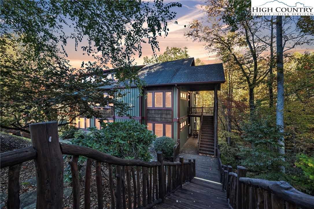 89 Springhouse Drive, Unit A4 Elk Park, NC 28622 - Photo 5 of 46 a house view with a garden space