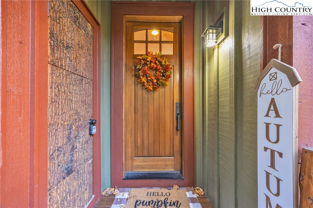 89 Springhouse Drive, Unit A4 Elk Park, NC 28622 - Photo 7 of 46 a view of front door with door